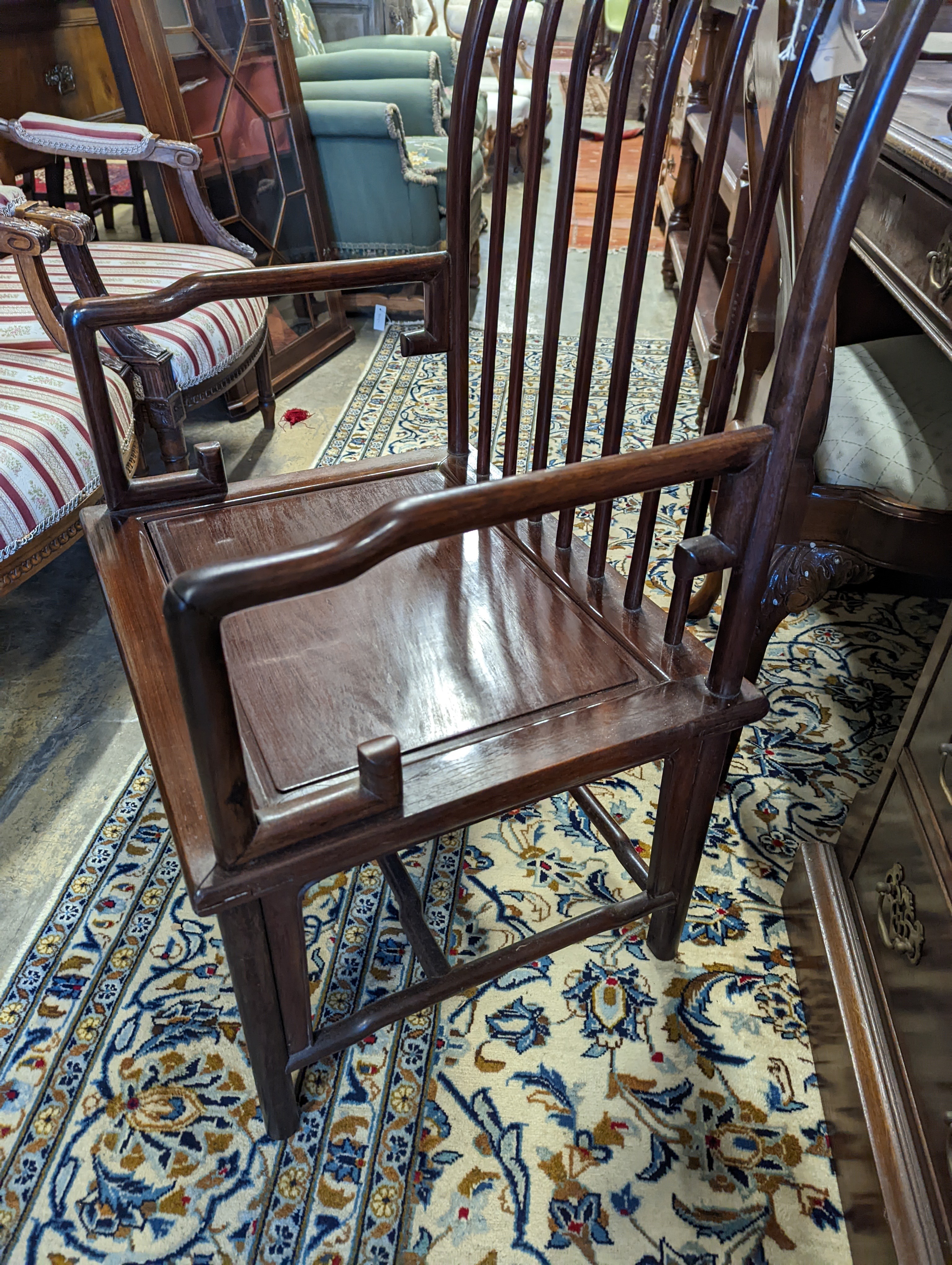 A pair of mid 20th century Chinese Hongmu elbow chairs with cushion seats, width 58cm, depth 49cm, height 92cm